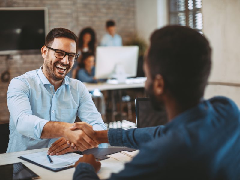 Two,Men,Handshake,In,The,Office